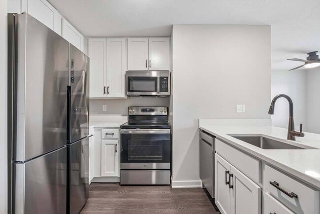 Clean lines, bright cabinetry, and stainless steel finishes come together in a modern kitchen designed to elevate everyday living.