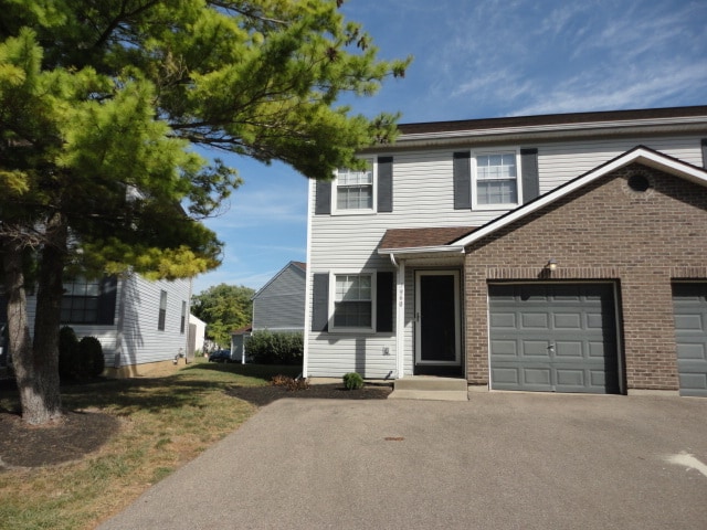 Left side of a duplex building with one car attached garage with opener - 7960 Bobtail Ct Rental