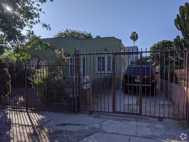 Fully Gated property/Secure and safe with two parking spaces in the rear of the driveway . - 2215 Carmona Ave Rental