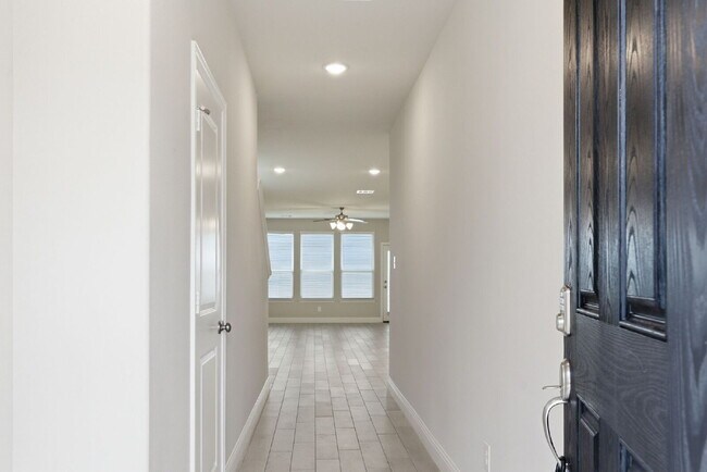 Photo - "Open-Concept 4-Bedroom, 2.5-Bath with Designer Finishes and Peaceful Greenbelt Views!"
