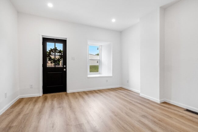 Photo - $1795 - Single Family Home with Private Two-Level Living Spaces, Driveway Parking & Modern Updates