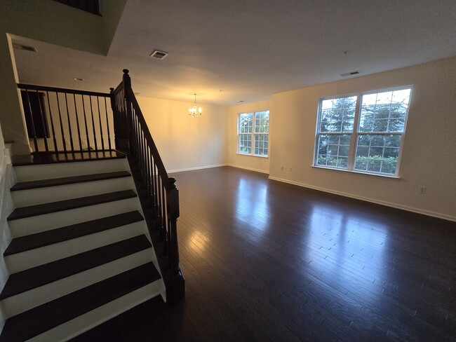 Spacious first floor open concept living and dining room - 39 Station Sq Townhome