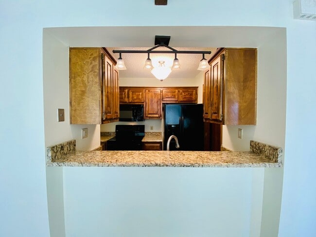 Photo - {12030 - F}  Updated Condo in Fantastic Location + Top Floor + Covered Parking Included + Private...