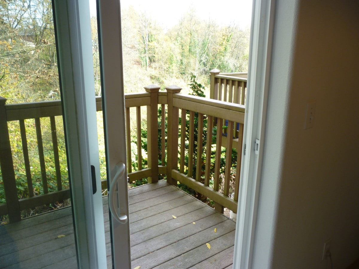 Patio over looking HessCreek. - 426 Wynooski St Apartment Unit A