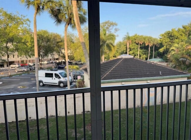 Building Photo - 8750 Royal Palm Blvd Unit 209