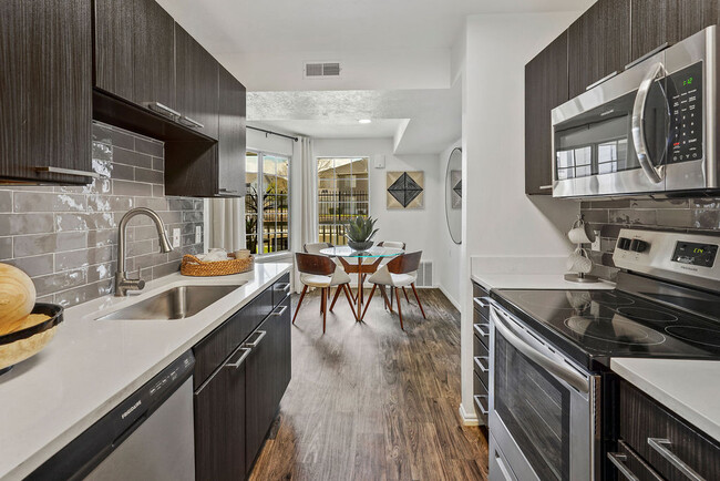 Renovated Kitchen and Dining Area - Woodgate Apartments