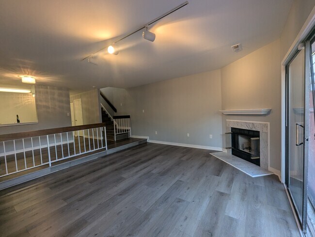 Living room with separate dinning area. - 3145 Hawthorne Dr NE Townhome