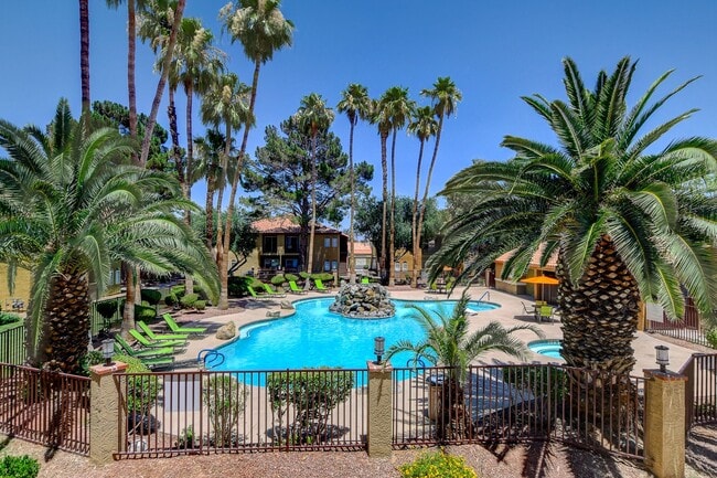 Unwind in the stunning oasis of Hidden Cove, where lush palms frame a sparkling pool, inviting relaxation and leisure. Enjoy sun-soaked days and tranquil evenings in this serene setting. Schedule your tour today and find your perfect retreat!