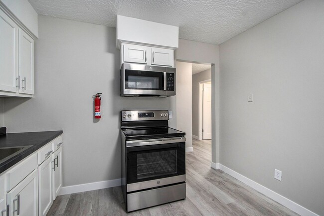 Photo - $1049 Renovated 2 bedroom 1 bathroom apartment with wooded views and patio Unit 1321 Huntington #2
