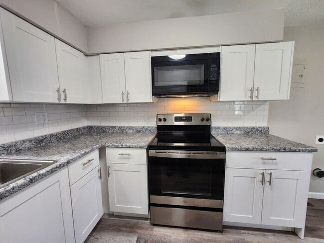 Photo - 2-Bedroom Townhome with Fenced Backyard and Modern Updates!