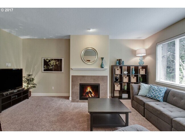 Photo - Bright and Open Floor Plan with Fireplace, Attached Garage & Vaulted Ceilings