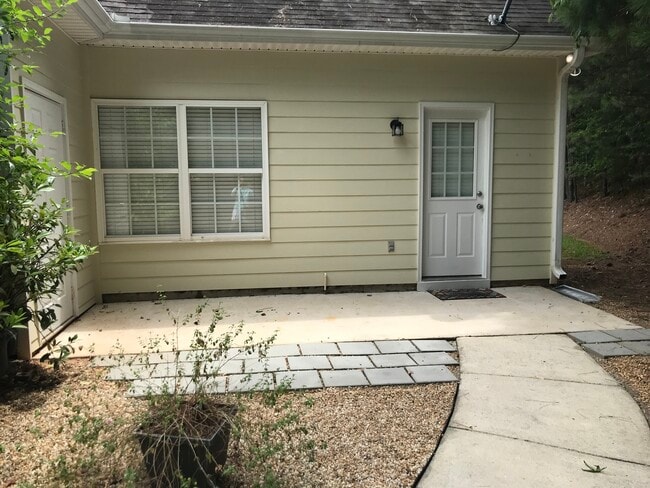 Back patio has access to unit dedicated parking area, outside storage room and a large patio great for grilling! - 1305 Cedar Shoals Drive #500