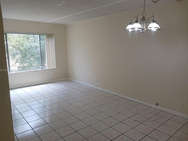 Building Photo - 3232 NW 102nd Terrace Unit 205-F Rental