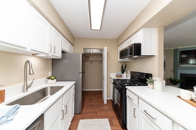 Kitchen with quartz counters and modern cabinetry.