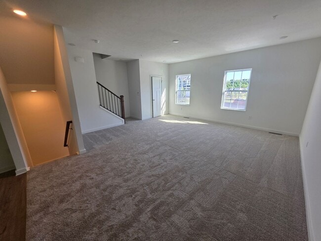 Photo - Brand-new townhome with modern finishes, flexible living space, and low-maintenance living.