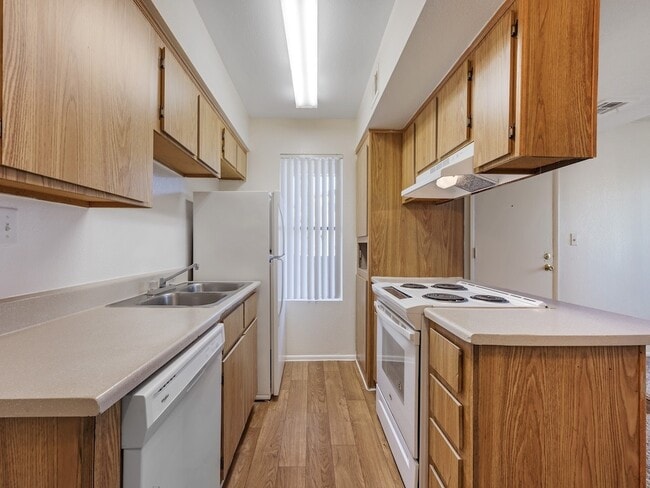 Kitchen with White Appliances - Glen Oaks Apartments