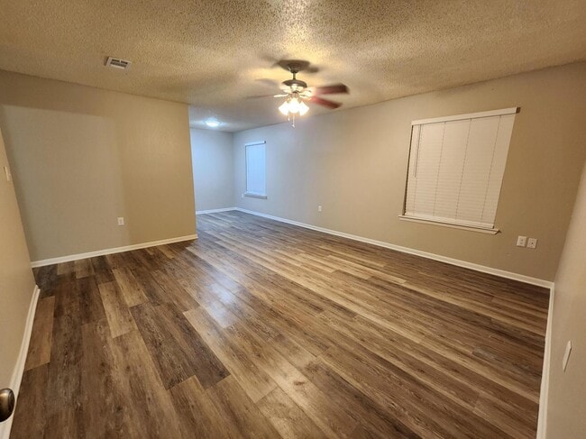 Large living space with solid surface flooring, upgraded lighting. This one may be yours!