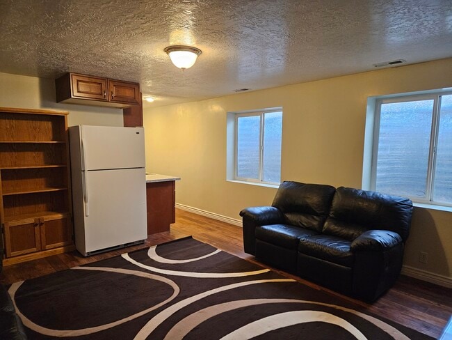 Furnished family room - 8771 S 1850 W Unit Basement Apartment