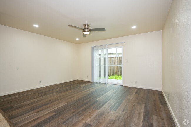 2BR, 1.5BA - 1,000SF - Living Room - The Townhouse Apartments