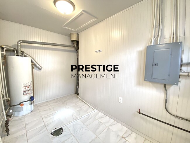 Photo - Updated Home with Central Air, Fenced Yard, and Two-Car garage!