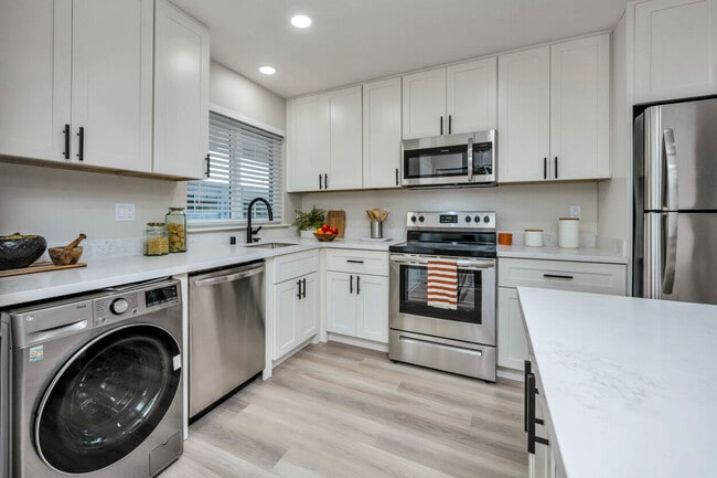 Kitchen Area With Wooden Flooring - The Meridian Apartments