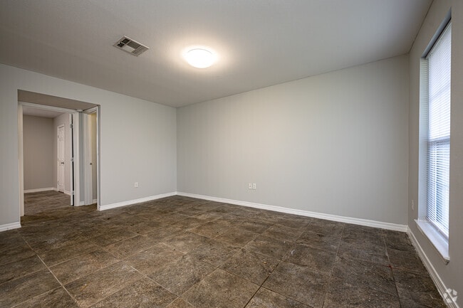 1BR, 1BA - 625SF - Living Room - Pine Square Villas