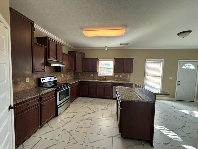 Photo - This property blends ample living space and storage with functional amenities.