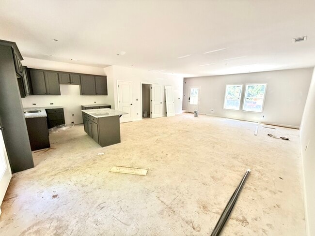 View of first floor. Open concept kitchen, dining room and living room.