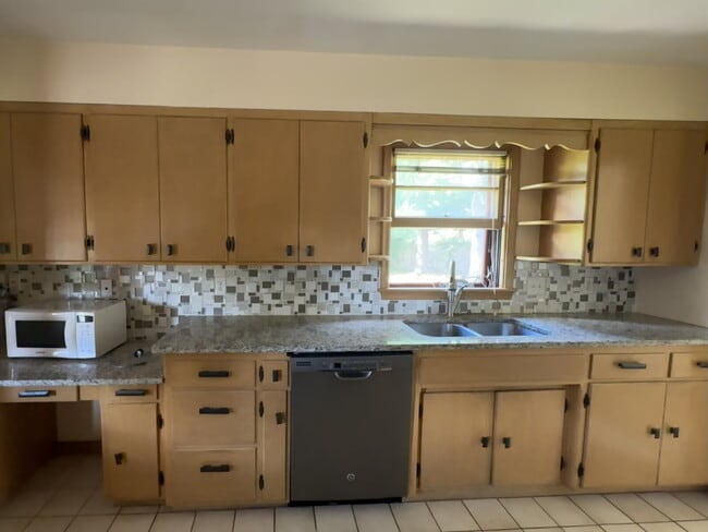 Photo - 3BR/1BA in Roseville Featuring A Sprawling Fenced Yard & An Attached Garage