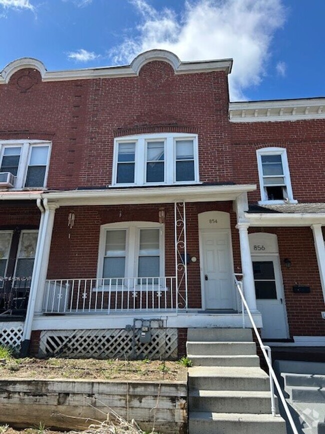 Building Photo - Three Bedroom 1 and Half bath Row Home wit...