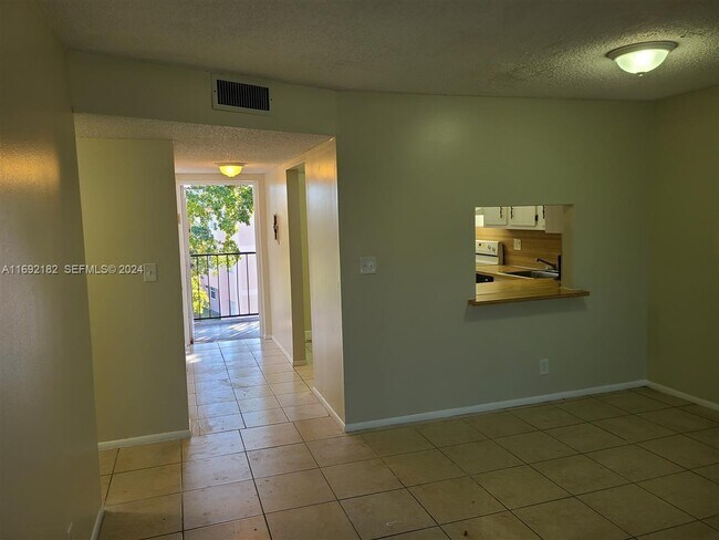 Building Photo - 8411 Lagos De Campo Blvd Unit 303U