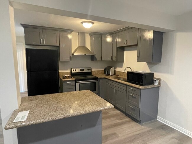 Kitchen with island - 3361 E Andy St Unit 1