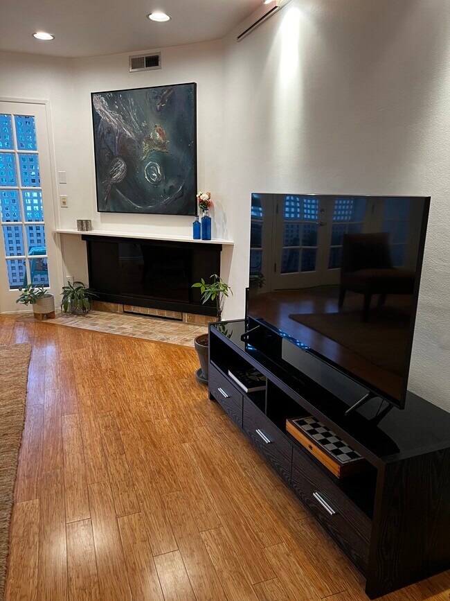 TV across from couch - 901 10th St Unidad Furnished Home w Den