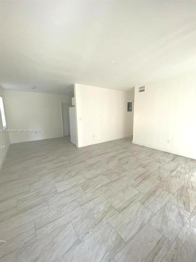 Photo - Updated 3-Bed/2-baths Home with Screened Porch & Lush Yard in Pompano Beach Highlands