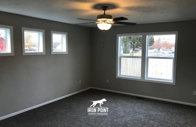 Photo - 3bed/2bath - Landscaping Included plus fenced yard, & two car garage.