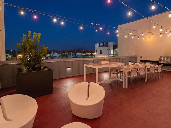 Our stunning Rooftop Terrace with BBQ grill and multiple seating areas.