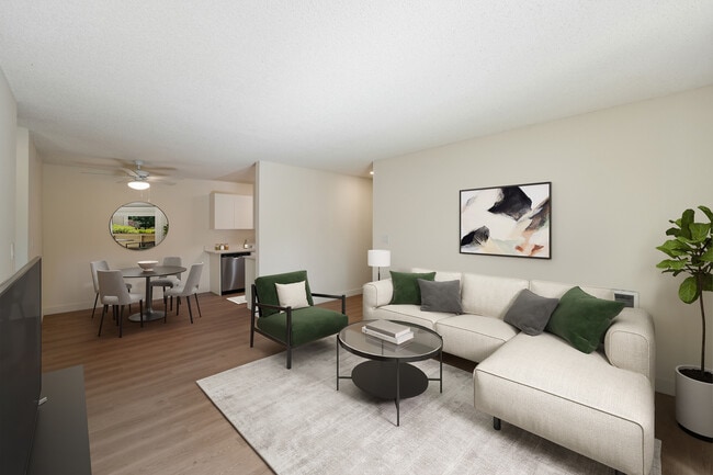 Renovated Package II dining and living room with hard surface flooring