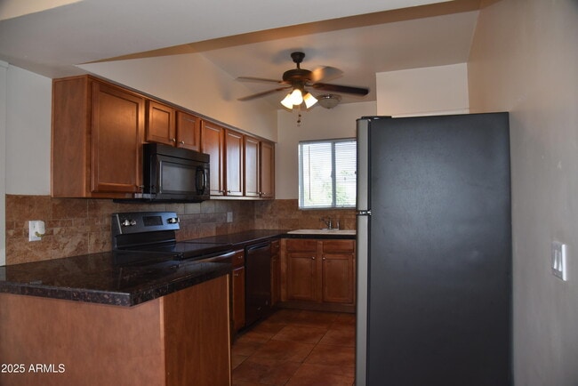 Building Photo - 6804 E 2nd St Unit 12