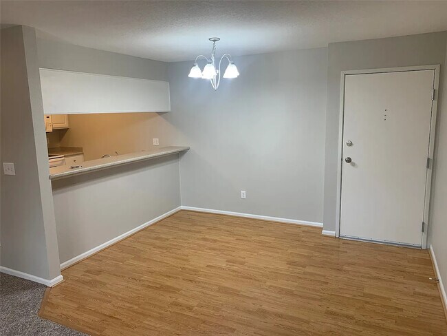 Oversized open dining area with large bar area. - 105 NW 8th St Unit 205