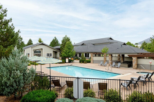 Relax by the peaceful poolside in this beautiful residential setting. - Timberline Place