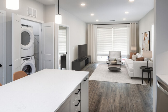 Upgrade Collection living room with in-home washer and dryer and hard-surface flooring