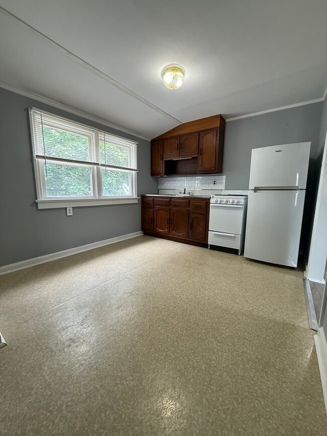 Kitchen with appliances, new sink and room for a table - 29 W 7th St Apartments Unit 2nd floor