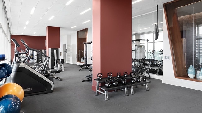 Fitness center with Technogym® cardio and weight equipment and three flex studios, featuring kickboxing, Peloton® cycle bikes and Fitness On Demand™ - Ardan