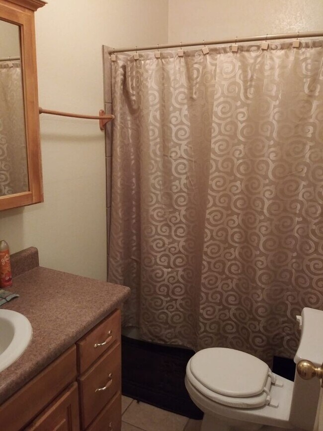 Photo - Modern town home with AC. 3/2. Covered, off-street parking, easy care yard.  Ample kitchen. Lamin...