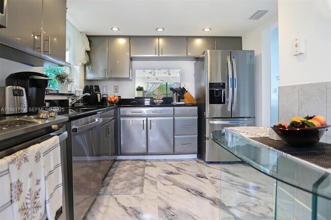 Building Photo - 6570 Royal Palm Blvd Unit 301J