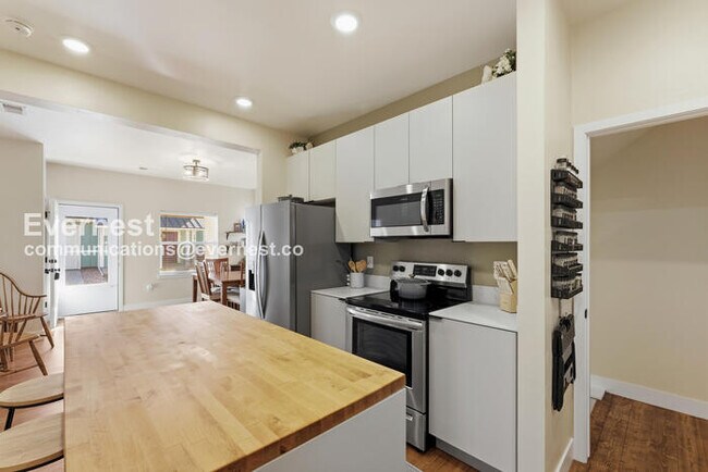 Photo - 4 Bed/3 Bath Townhome with Fenced Yard & Garage / Available Now!