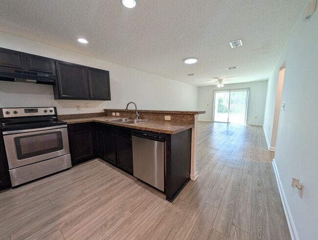 Photo - NOW AVAILABLE - 3/2 Duplex on this 12 mo Lease - Conveniently located off Lewis Speedway near St ...