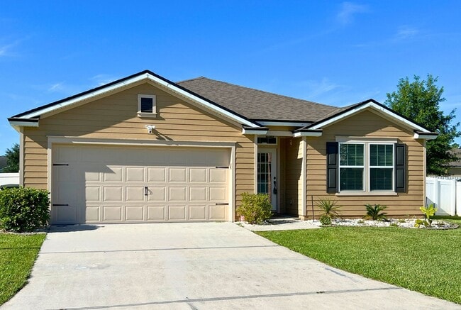 Building Photo - Stylish 4-Bedroom Home with Fenced Yard – ...