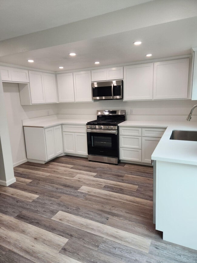 Kitchen with stove, microwave, dishwasher