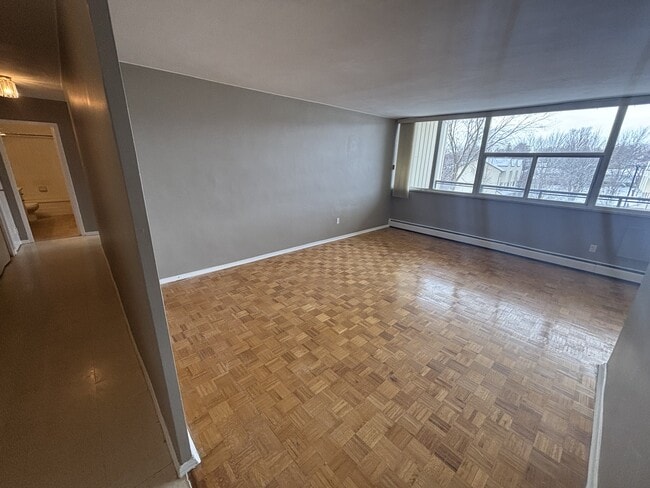 Building Photo - 1061 Queen's Blvd Unit 207